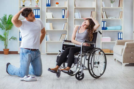 Patient undergoing rehabilitation recovery programme with doctorの写真素材