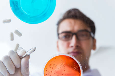 Chemist working in the laboratory with hazardous chemicalsの写真素材