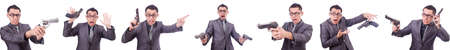 Funny businessman with gun on whiteの写真素材