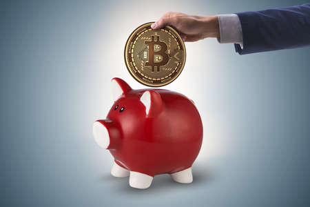 Bitcoin saving with piggybank in business conceptの写真素材
