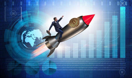 Businessman flying on rocket in bitcoin price rising conceptの写真素材