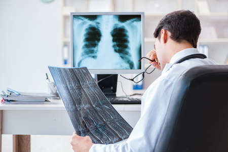 Doctor radiologist looking at x-ray images