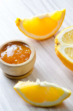 Orange jam served in spoon on the tableの写真素材