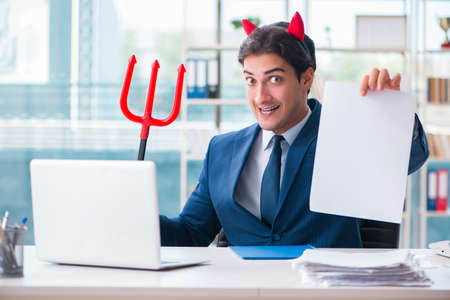 Devil angry businessman in the officeの写真素材