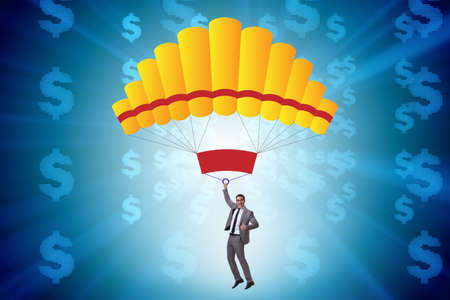Businessman in golden parachute conceptの写真素材