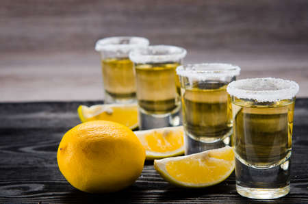 Tequila drink served in glasses with lime and saltの写真素材