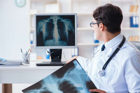 Doctor radiologist looking at x-ray images