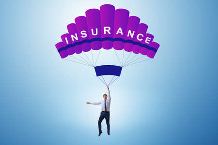 Businessman in insurance concept on parachuteの写真素材