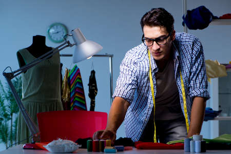 Male tailor working in sewer shopの写真素材