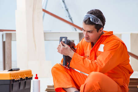 Contractor working on laminate wooden floorの写真素材