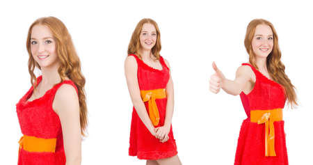 Young beautiful girl in red dress thumbs up isolated on white backgroundの写真素材