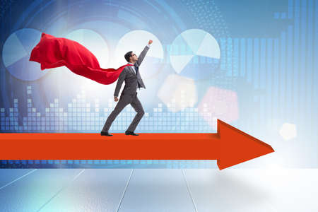 Superhero businessman standing on arrow