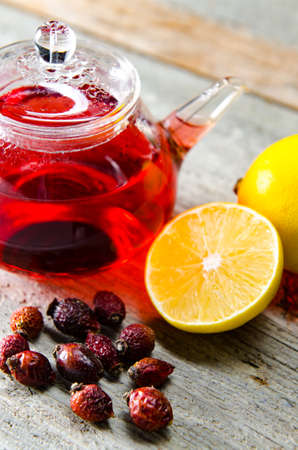 Fruit berry tea in the cup served on tableの写真素材