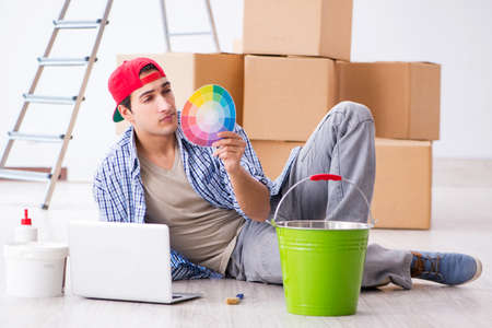 Young painter contractor choosing colors for home renovationの写真素材