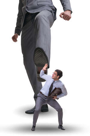 Bad angry boss kicking employee in business conceptの写真素材