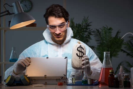 Forensic investigator working in lab looking for evidence