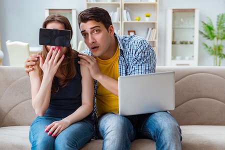 Young family playing games with virtual reality glassesの写真素材