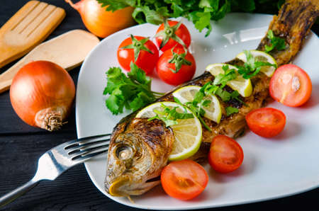 Fried fish served on the plate