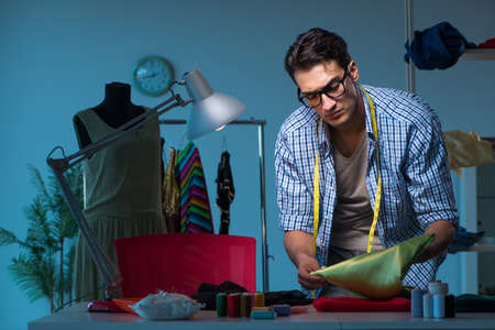 Male tailor working in sewer shop