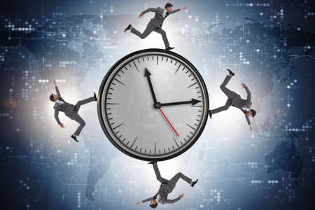 Businessman in time management conceptの写真素材