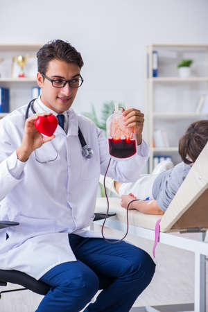 Patient getting blood transfusion in hospital clinicの写真素材