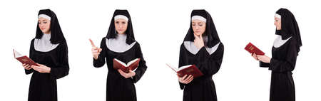 Young nun with bible isolated on whiteの写真素材