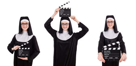 Young nun with clapperboard isolated on whiteの写真素材