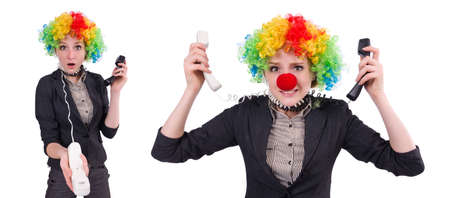 Businessman with clown wig isolated on whiteの写真素材