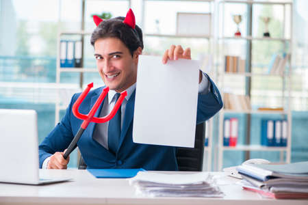 Devil angry businessman in the officeの写真素材