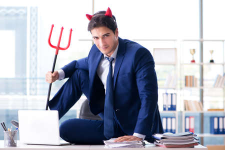 Devil angry businessman in the officeの写真素材