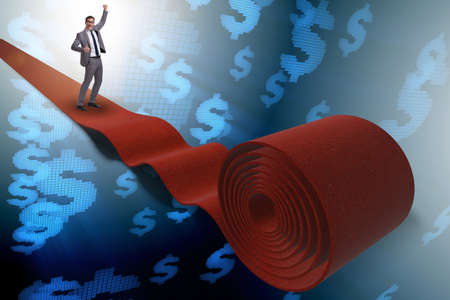 Businessman with dollars on red carpetの写真素材