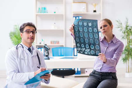Doctor examining x-ray images of patient
