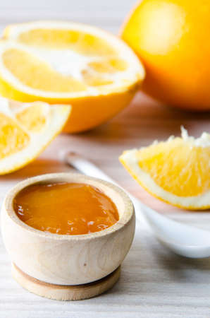 Orange jam served in spoon on the tableの写真素材