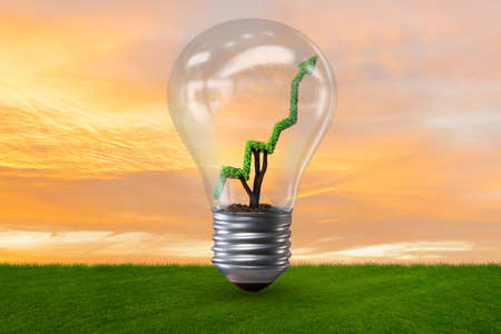 Green energy concept with green line graph in light bulb