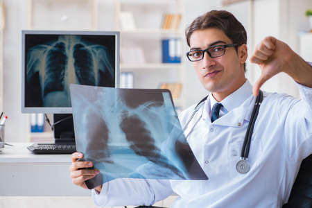 Doctor radiologist looking at x-ray images
