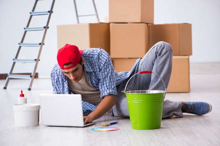 Young painter contractor choosing colors for home renovation