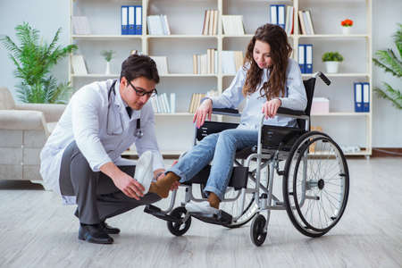 Disabled patient on wheelchair visiting doctor for regular check