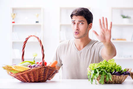 Young man in healthy eating and dieting conceptの写真素材