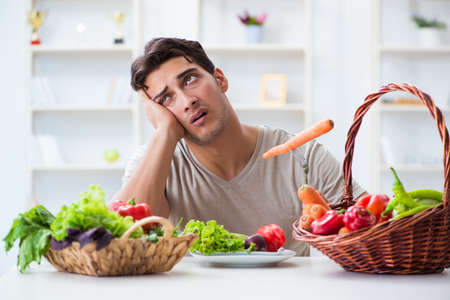 Young man in healthy eating and dieting conceptの写真素材