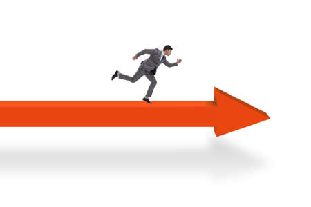 Businessman walking on arrow isolated on white backgroundの写真素材