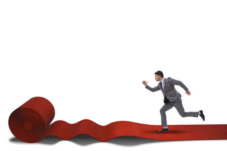 Businessman on red carpet isolated white backgroundの写真素材