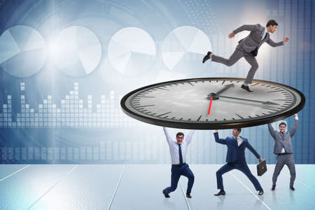 Businessman in time management conceptの写真素材