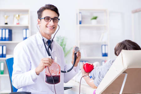 Patient getting blood transfusion in hospital clinicの写真素材