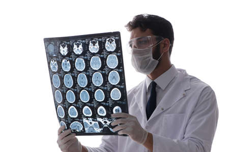 Young doctor looking at x-ray images isolated on white