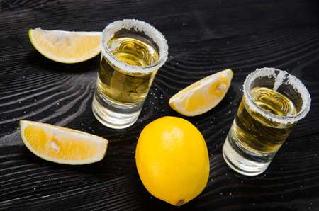 Tequila drink served in glasses with lime and saltの写真素材