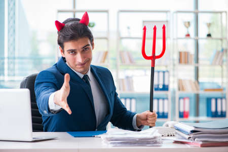 Devil angry businessman in the officeの写真素材