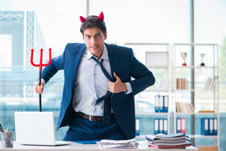 Devil angry businessman in the officeの写真素材