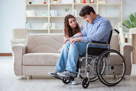 Desperate disabled person on wheelchairの写真素材