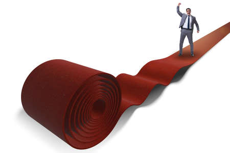 Businessman on red carpet isolated white backgroundの写真素材