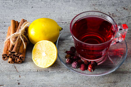 Fruit berry tea in the cup served on tableの写真素材